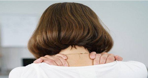 blog picture of woman grabbing her upper back and shoulders