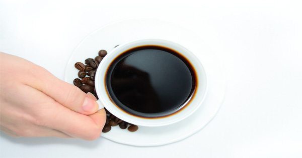 blog picture of hand grabbing a cup of coffee