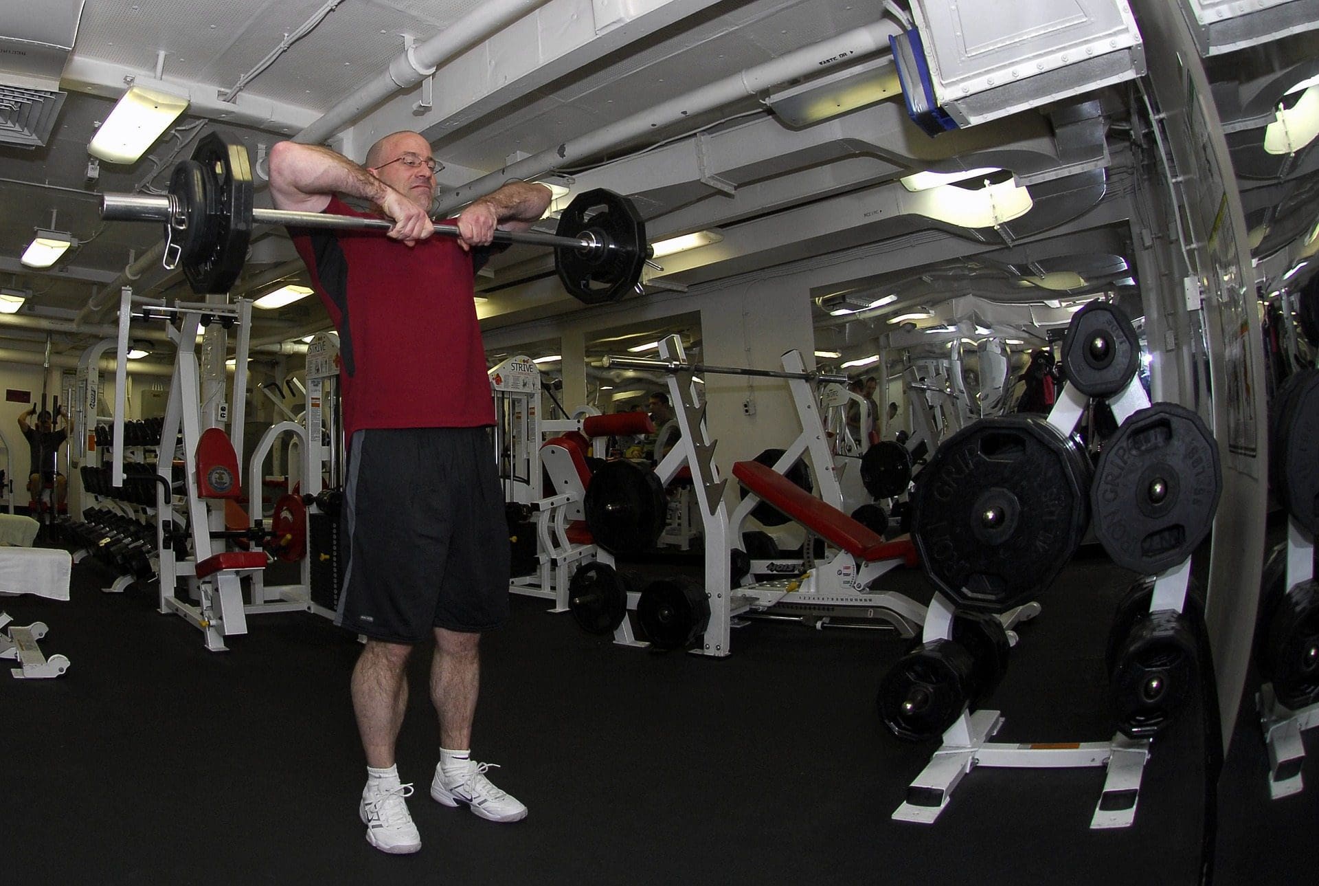 blog picture of older man in gym lifting weights