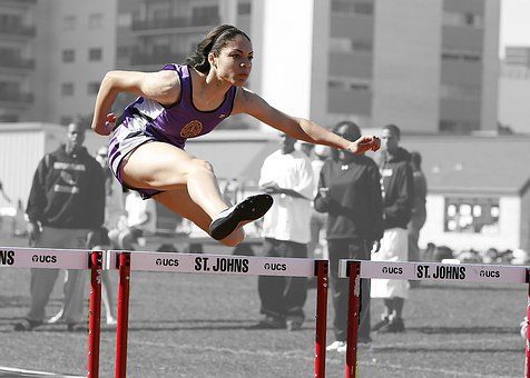 blog picture of young girl jumping hurdles