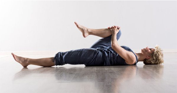 blog picture of lady stretching her leg on the floor