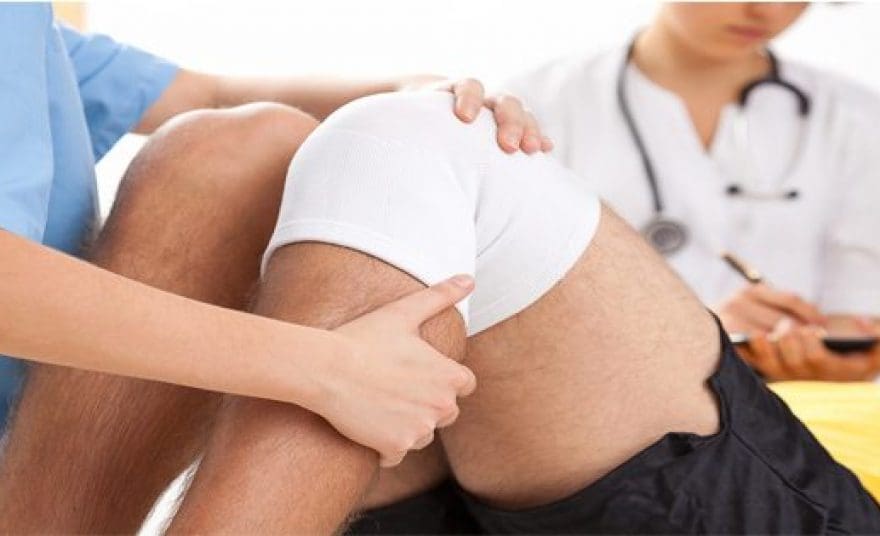 blog picture of athlete at doctor's office with meniscus injury