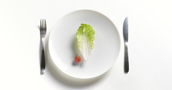 blog picture of plate, fork, knife, piece of lettuce and baby tomato