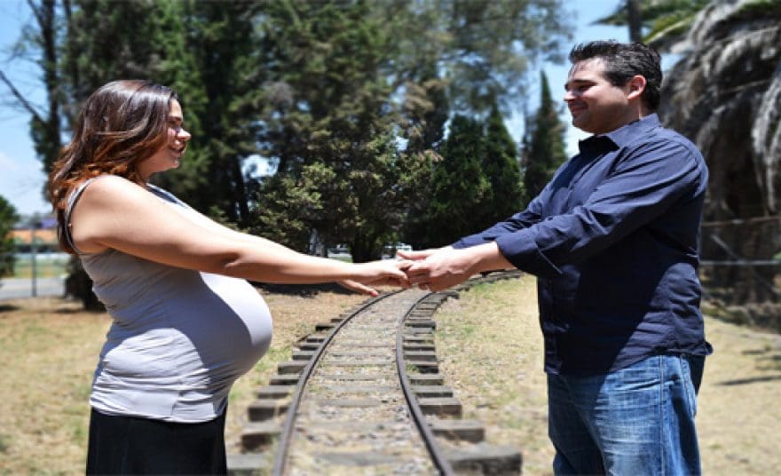 blog picture of couple on railroad tracks holding hands