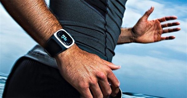 blog picture of runner wearing a fitness tracker on wrist