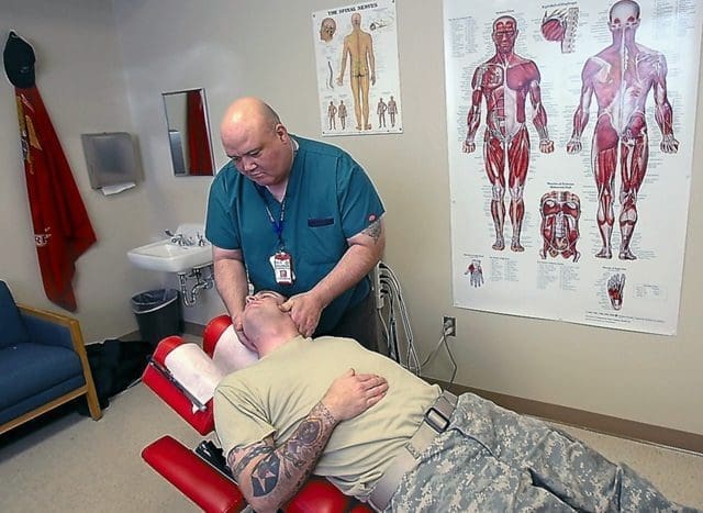 PTSD veteran receiving chiropractic treatment