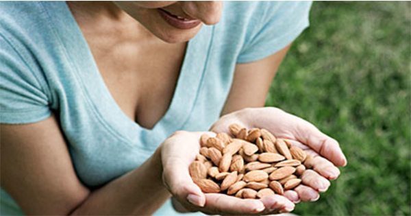 blog picture of woman looking at almonds